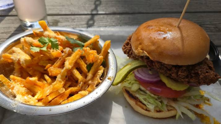 Squid Ink signature dishes Mobtown Hot Chicken SandwichShrimp PoboyCadillac Burger